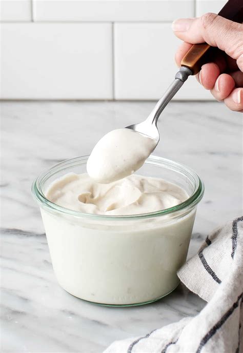 Sour cream for vegans. Drain the cashews. Add the cashews, broth or water, and salt to a blender, then blend on high for 1 minute. Stop and scrape, then add additional liquid if necessary to come to a creamy consistency. Blend for several minutes until creamy and smooth. 