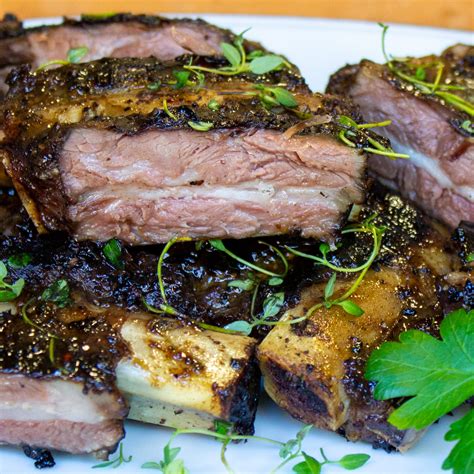 Remove shallots from top surface of meat. Place pan with tenderloin under broiler and broil, turning every 30 seconds, until meat is well browned on all sides and internal temperature registers 125°F (52°C) for rare or 130°F (54°C) for medium-rare, about 2 minutes total. Proceed to step 5.. 