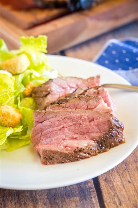 Preheat oven to 450º. Remove meat from marinade and pat it dry. Discard marinade or reserve for optional pan sauce. Place tri-tip, fat side up, on a rack in a shallow roasting pan. Roast for 20 minutes, then begin checking temperature. Remove tri tip at 115º to 120º for rare, 120º to 125º for medium-rare.. 
