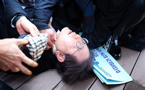 South Korean opposition leader conscious after being stabbed in the neck