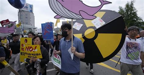South Koreans protest the planned release of Fukushima wastewater during a visit by the head of IAEA