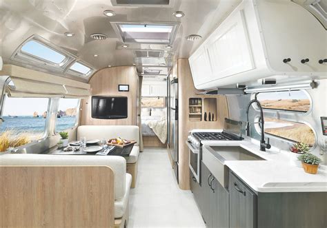 WE ARE EVERYWHERE AND WE SELL ANYWHERE 2023 Airstream Flying Cloud 27' Front Twin Beds Sunlit Maple with Seattle Mist Ultraleather NEW - IN STOCK Location: SPOKANE Stock# F11846 . 
