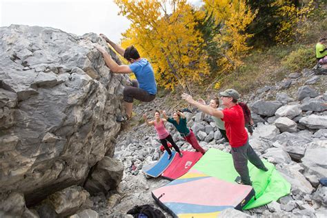 Southern alberta bouldering association.  A group of climbers stand amon...