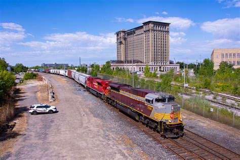 In the south side Corktown district of Detroit, Canadian Pacific's eastbound 140 ducks down towards the gravity-fed international tunnel with script unit .... 