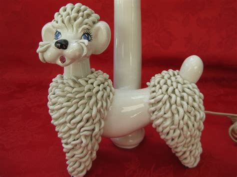 Spaghetti poodle lamp. White poodle lamp with spaghetti style porcelain, hand painted black features. Sits on black. Materials. Porcelain. View Full Details. Italian Porcelain Poodle Lamp. 