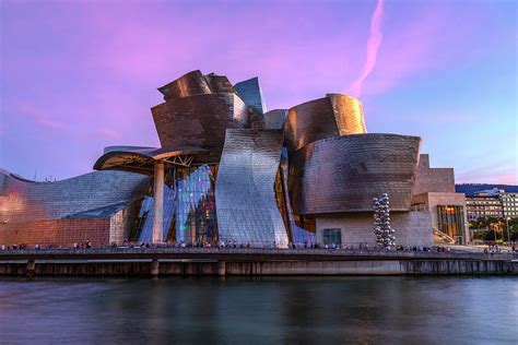 Spain's guggenheim museum. The Guggenheim Museum Bilbao. Set on the river’s edge, Frank Gehry’s swirling and captivating Guggenheim Museum Bilbao, built of titanium, glass, and limestone, is a work of art in its own ... 
