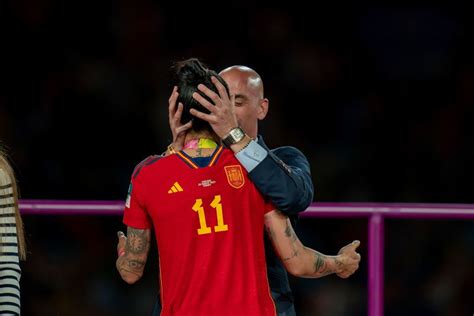Spanish football federation threatens legal action against star player in kiss controversy