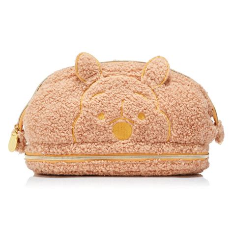Spectrum winnie the pooh makeup bag. Say hello to the softest most cuddliest brush set from the best bear in all the world! Fresh from the Hundred Acre Wood and dripping in runny hunny, the 8 piece Winnie the Pooh brush set includes 5 brushes for a flawless complexion and 3 detailer brushes for adding precision to any makeup look. 