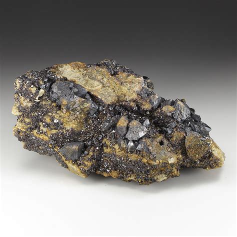 Sphalerite. Chemical composition: ZnS. Color and Luster: color varies from yellow to light to dark brown, red-brown, red, black, and colorless, and is less commonly light blue or green. It has a resinous to adamantine luster. Hardness: 3.5 to 4. Cleavage: 1 perfect. Specific gravity: 3.9 to 4.1. Crystal system: Isometric crystal system