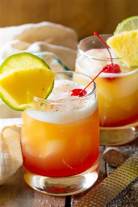 Spiced rum drink recipes. Mix together all ingredients in a pitcher or individual glass (if making one drink). Chill in refrigerator for at least 1 hour before serving. Garnish with pineapple slices, lime wedge and maraschino cherry, if desired. Pour over ice in individual glasses to serve. 