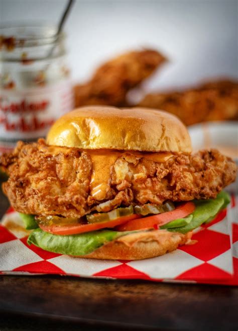 Spicy chicken sandwich recipe. Heat oil in a deep-fryer to 350 degrees F. In a small bowl combine hot pepper sauce and water. In a shallow bowl or pie plate combine flour, salt, cayenne pepper, black pepper, onion powder, paprika, and garlic powder. 