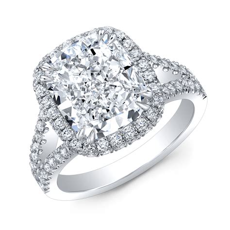 Split shank engagement ring. Product Details. Love shines brightly from this engagement ring boasting a center stone surrounded by a stunning diamond halo, and diamonds trailing along the split shank for a stunning effect. It is beautifully designed in 18k white gold, with a hidden halo and delicate lace detail along the profile accented with milgrain detail and hidden ... 