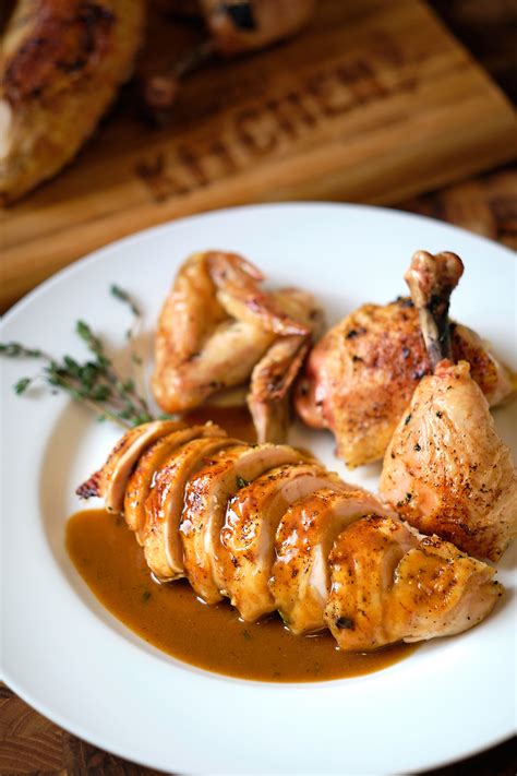Instructions. Preheat oven to 425°F. Brush chicken with olive oil and season well with seasonings. Place chicken in a shallow roasting pan and cook 40-50 minutes or until chicken reaches 165°F. Garnish with parsley if desired.