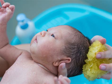 Sponge bath. Newborn babies don't get very dirty so a sponge bath will do the trick. Don't forget to wash between the folds of skin and behind the ears. More from Pampers... 