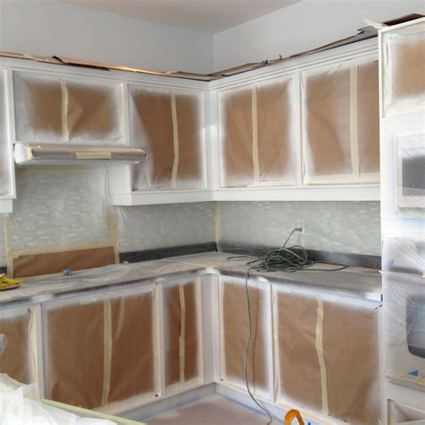 Spray painting kitchen cabinets. The longevity of spray painted kitchen cabinets depends on the quality of materials and level of care used in the painting process. High-quality paint and a few coats of finish product should last for several years with proper care. The finish should be kept clean with a damp cloth, and liquid spills should be wiped away immediately. ... 