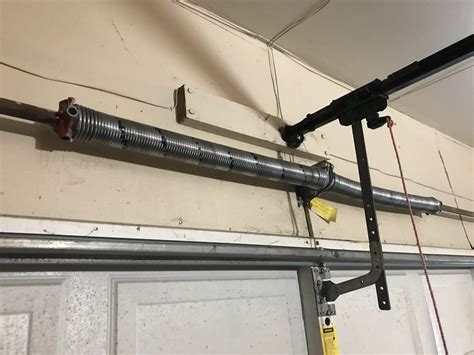 Spring garage doors. Garage springs are under an extreme amount of tension and either stretch or torque, providing enough force to help you move the door. There are several types of garage … 