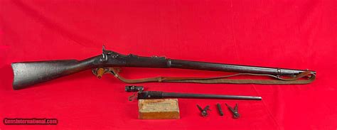Springfield 1873. The Springfield Trapdoor Cartridge Rifle and Carbine was produced for the military in 1873. It was a redesign of the Army’s Allin Trapdoor rifle. The Springfield Trapdoor held the new, more powerful .45-70 military cartridge. Full-stocked, 32 inch barreled rifles, as well as half-stocked, short-barreled carbines, were produced. 