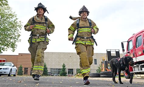 St. Paul firefighters tackling the Twin Cities Marathon in full gear for a cause — their fallen co-workers