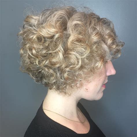 Stacked bob hairstyles for curly hair. 1. Layered A-Line Bob. Save. An a-line bob can be bluntly cut or it can be softer and feature feathered or wispy layers. For women over 50 with fine hair, layers will only help in giving your hairstyle gorgeous body. 2. Curly Bob for Round Face. Save. 