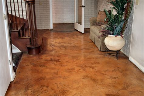 Stained concrete floors. Stained Concrete uses a process in which liquid dye is applied to a plain concrete slab, chemically staining the floor to create an aged appearance and ... 