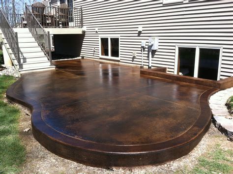 Stained concrete porch. To remove this type of stain from concrete: Pour one-eighth of a cup of liquid dishwashing detergent into a spray bottle, then top off the bottle with warm water and shake well. Spray the concrete ... 