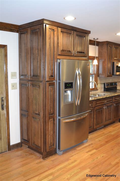 Stained maple cabinets. ... stained in darker colors. Maple wood may have mineral streaks and small knot – like marks. Maple wood can come in a variety of stains and may yellow with age. 
