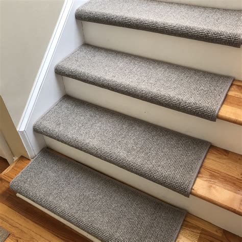 Stair carpet bullnose. It's also more commonly used than the Hollywood method. It's ideal for striped or patterned carpets as the pattern runs much more smoothly down the stairs. The image below captures the waterfall method. Instead, though, of being a runner, this is a wall-to-wall installation we completed. >> See How New Flooring Transforms 1980s Connecticut Condo. 
