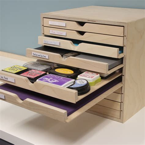 Stamp n storage. The Lock-Down Punch Holder has the option of being wall-mounted to maximize wall storage space in your paper crafting studio. The horizontal dividers of the Stamp-n-Storage Punch Holder are all removable (except for the glued-in center divider), giving you additional punch and accessory storage options. 