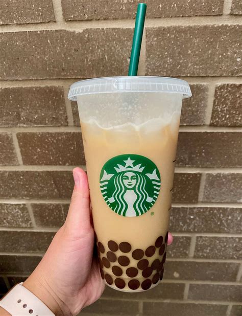 Starbucks boba tea. Starbucks’ test of Coffee Popping Pearls that look like boba drinks began in two U.S. cities in winter 2021. ... a coffee version called In The Dark and the Iced Chai Tea Latte with Coffee ... 