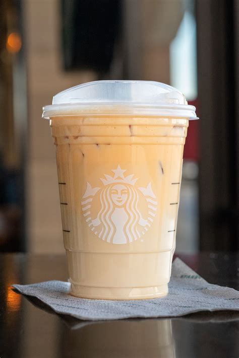Starbucks chai tea. Black tea infused with cinnamon, clove and other warming spices is combined with milk and ice for the perfect balance of sweet and spicy. 240 Calories, 42g sugar, 4g fat Full nutrition & ingredients list 