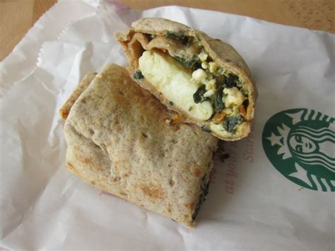 Starbucks feta and spinach wrap. Fold in half, and place egg patty on the center of the tortilla. Remove skillet from heat, respray, and return to medium heat. Add spinach, sun-dried tomatoes, and canned tomatoes. Cook and stir until spinach has wilted, about 1 minute. Add cheese. Cook and stir until hot, about 1 minute. Top egg patty with spinach mixture. 