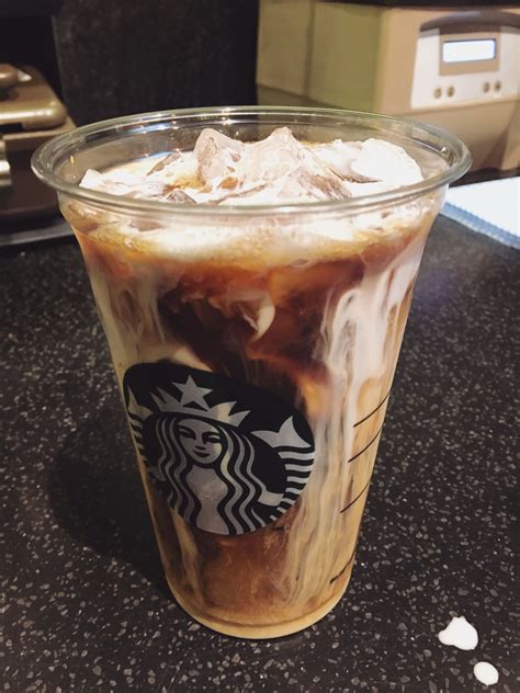 Starbucks vanilla sweet cream cold brew. Add cold brew concentrate to the glass: Pour ½ cup of cold brew concentrate into the glass over the ice. Whisk together heavy whipping cream, milk, and vanilla simple syrup: In a separate bowl, whisk together ½ cup of heavy whipping cream, ½ cup of milk, and 2 tablespoons of vanilla simple syrup. Whisk the mixture well to combine. 