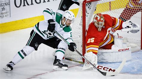 Stars score 3 in 2nd period and hold on to beat Flames 4-3