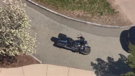 State trooper on motorcycle left with minor injuries after being struck by vehicle in Brookline