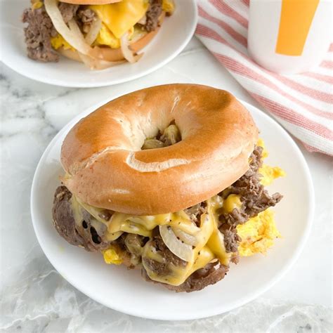 Steak egg cheese bagel. Nov 16, 2022 · Steak, Egg, & Cheese Bagel: a freshly toasted bagel smothered in real butter and topped with a folded egg, two slices of melted American cheese, and grilled onions Bacon, Egg, & Cheese Bagel ... 