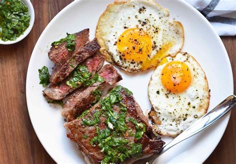 Steak eggs. In a medium size heavy bottom skillet heat to medium heat. Place 1/2 the butter in the skillet, when melted add the steak and sear 1-2 minutes on each side or until cooked your desired level. Remove steak and wipe the skillet clean, add the remaining butter and carefully crack eggs in skillet. 