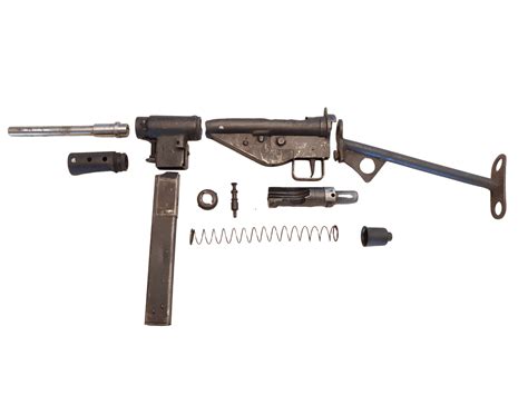Original British manufactured Sten MK2 SMG parts set, with a MK5 barrel nut, no stock included, 9X19 9mm Luger, in *Good* condition. Sold Individually.These original STEN parts kits are complete less the barrel, stock and the receiver tube.Loop stocks are available at SARCO.The trigger group housing tabs are intact.The front threaded collar …