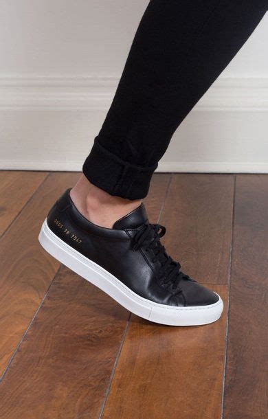 Step Out in Style with White Shoes with Black Soles