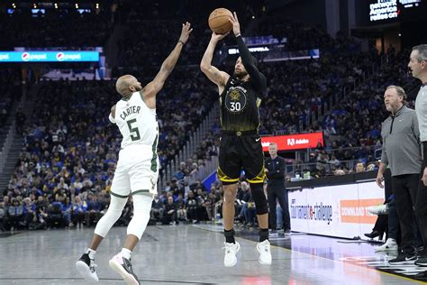 Steph Curry takes over to help Warriors beat Bucks in overtime