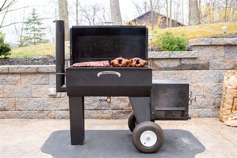Stick burner smoker. The 36" smoker cooker has 6 cubic feet of cooking space and hold approximately 60-72 pounds of food with room to spare. This size allows for a whole piglet (approximately 35-45 pounds) to be smoked. Approximately 6-8 full racks of ribs can be smoked at a time. The Deluxe warmer box provides additional slow cooking capacity. 