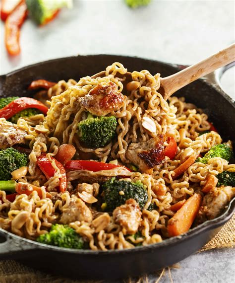 Stir fry ramen. Bring a medium pot of water to a boil, remove from the heat and add the ramen noodles; let sit for 2 minutes, then drain. Heat the remaining 1 tablespoon canola oil in a large skillet or wok ... 