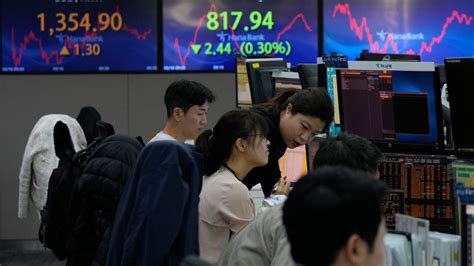 Stock market today: Asian markets edge lower as China reports slower growth in the last quarter