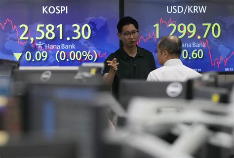 Stock market today: Asian shares are lower after central bankers say interest rates must stay high