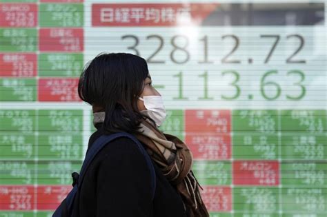 Stock market today: Asian shares are mostly higher after the Dow hits a record high, US dollar falls