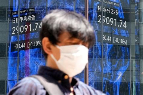 Stock market today: Asian shares mixed in choppy trading after US inflation report