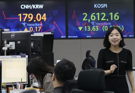 Stock market today: Asian shares mostly slip after US markets were closed for a national holiday