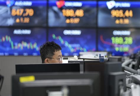Stock market today: Asian shares mostly slip as markets brace for US inflation report