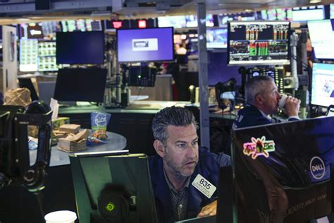 Stock market today: Wall Street dips as markets fall worldwide on worries about banks, economy