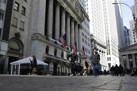 Stock market today: Wall Street ends higher as the bond market loosens its vise and oil falls