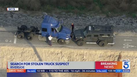 Stolen big rig driver on the run after ramming police vehicle, authorities say